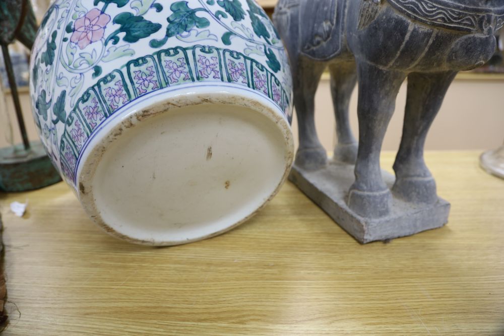 A Tang style carved stone model of horse and a jardiniere, tallest 52cm